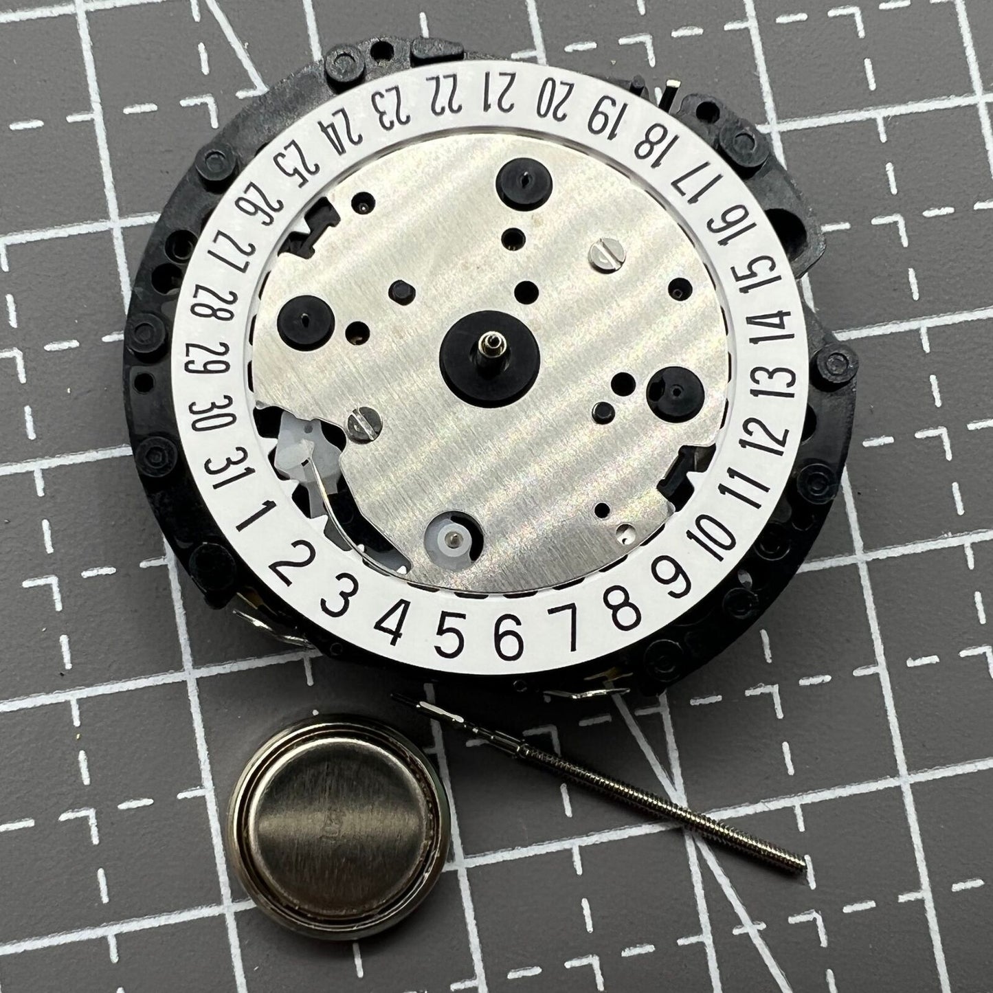 Hattori Epson VD53C quartz watch movement with date at 6, precision Japan-made component for repairs.