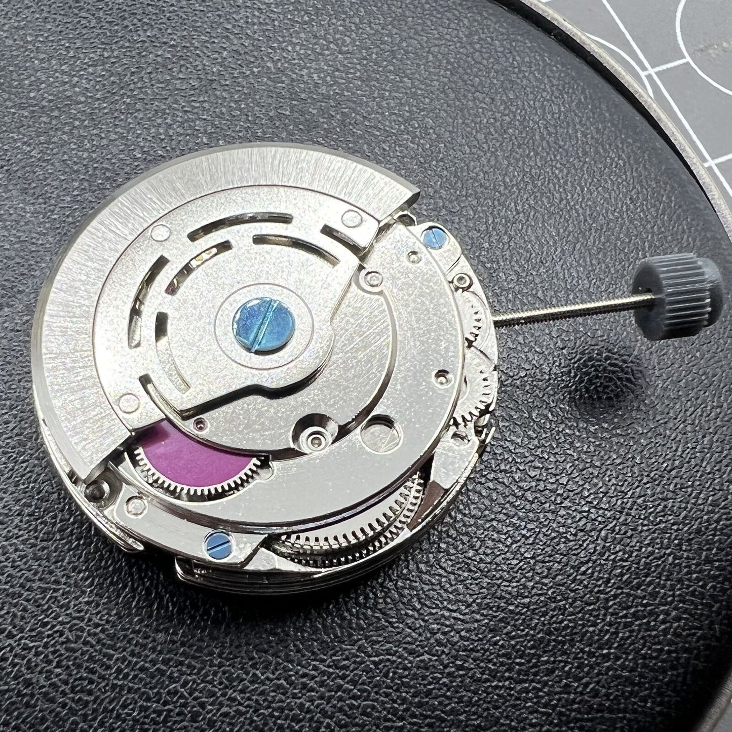 NN 8205 automatic watch movement with detailed gears and precision craftsmanship.