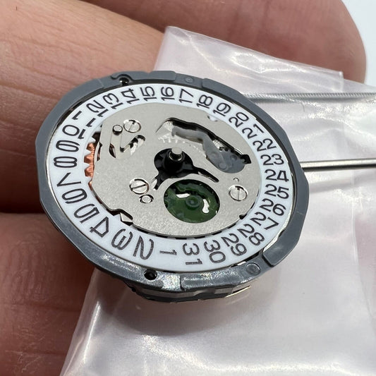 Miyota 1L15 Japan Quartz Movement with date display at 3 o'clock, precision Japan-made mechanism.