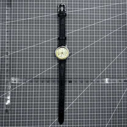 27mm Kongque watch with black strap, silver dial, gold markers, manual mechanical movement, 19 jewels.