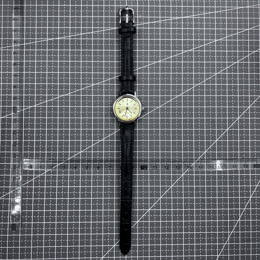 27mm Kongque watch with black strap, silver dial, gold markers, manual mechanical movement, 19 jewels.