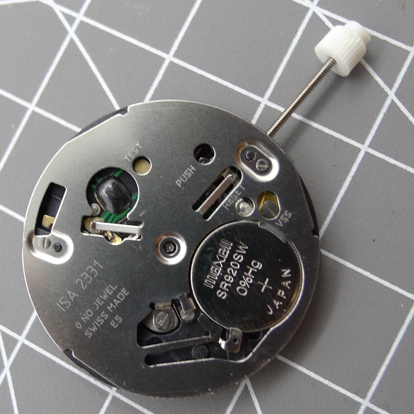 Swiss ISA 2331 watch part with black dial, quartz movement, and date display at 6 o'clock for accurate timekeeping.