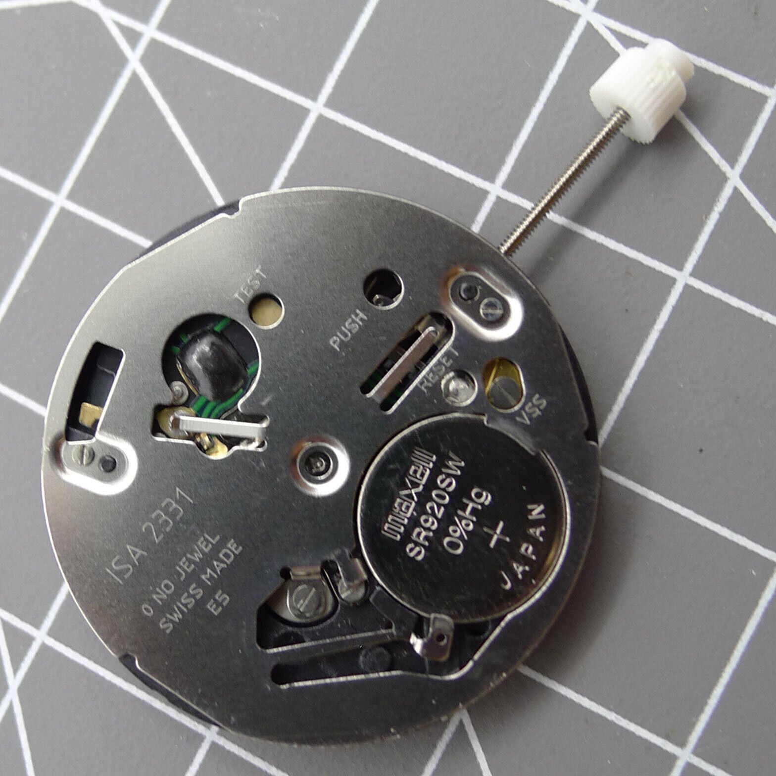 Swiss ISA 2331 watch part with black dial, quartz movement, and date display at 6 o'clock for accurate timekeeping.