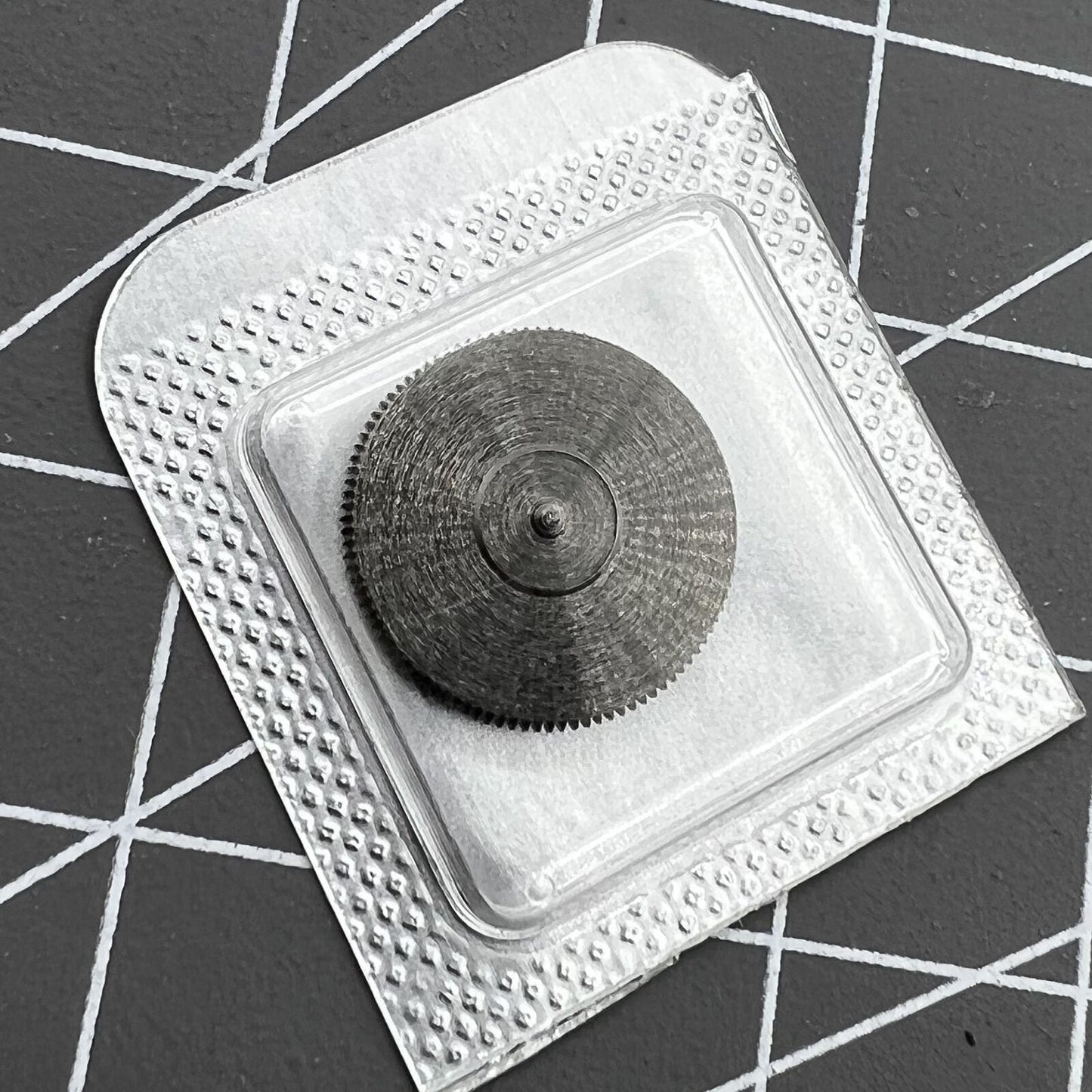 Barrel with complete mainspring for ETA C07.111 watch movement - precision fit component.