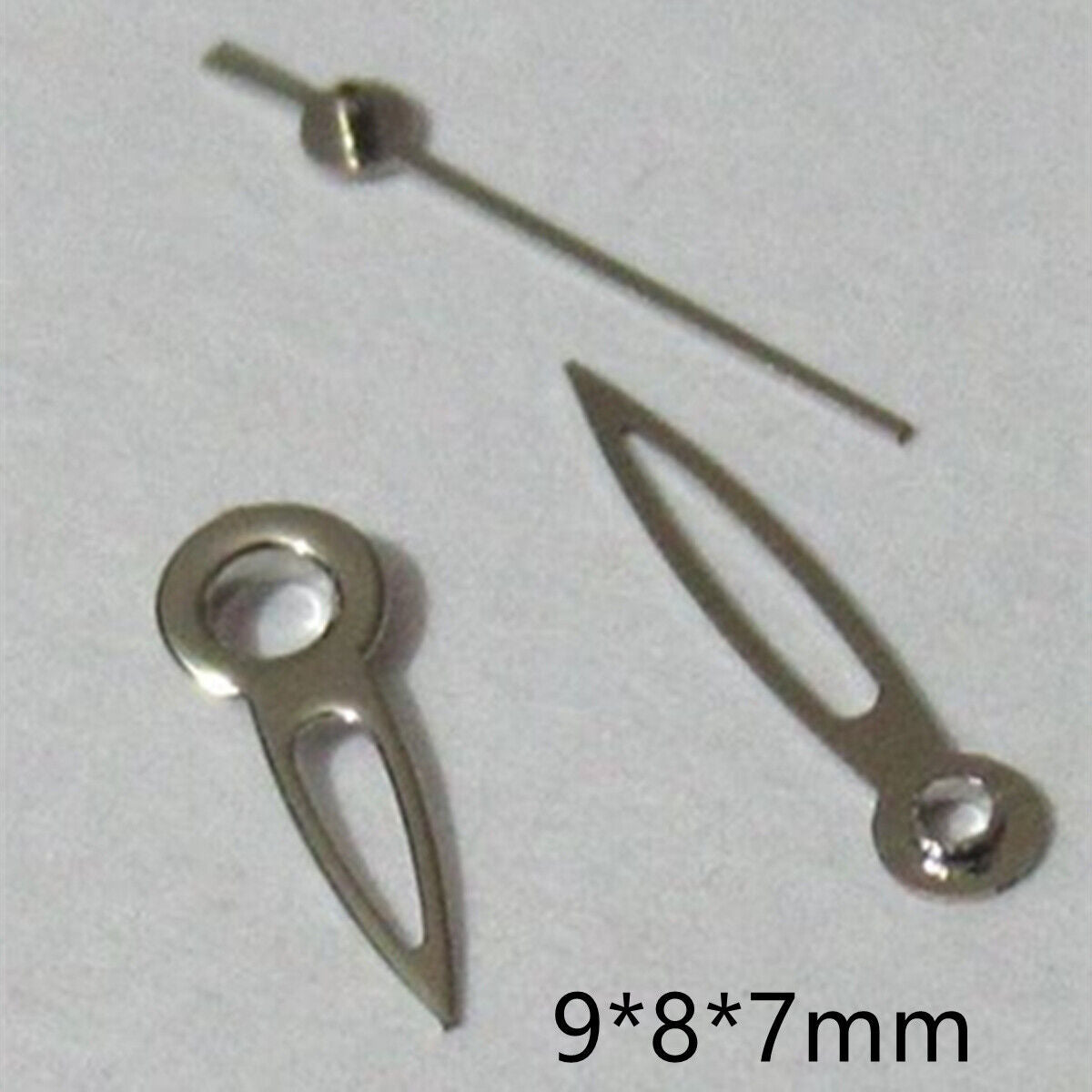 Arrow-shaped hollow silver watch hands set for Miyota 2035 movement, precise and stylish accessory.