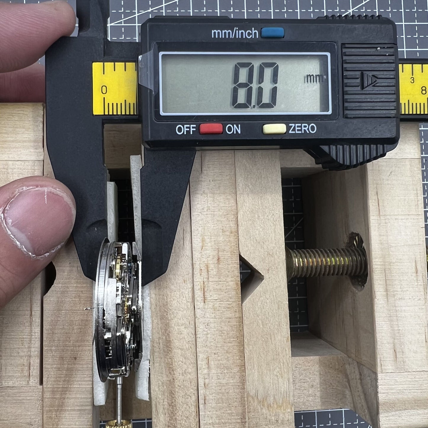 7750 black dial chronograph watch with three hands, small seconds at 9 o'clock, day-date display