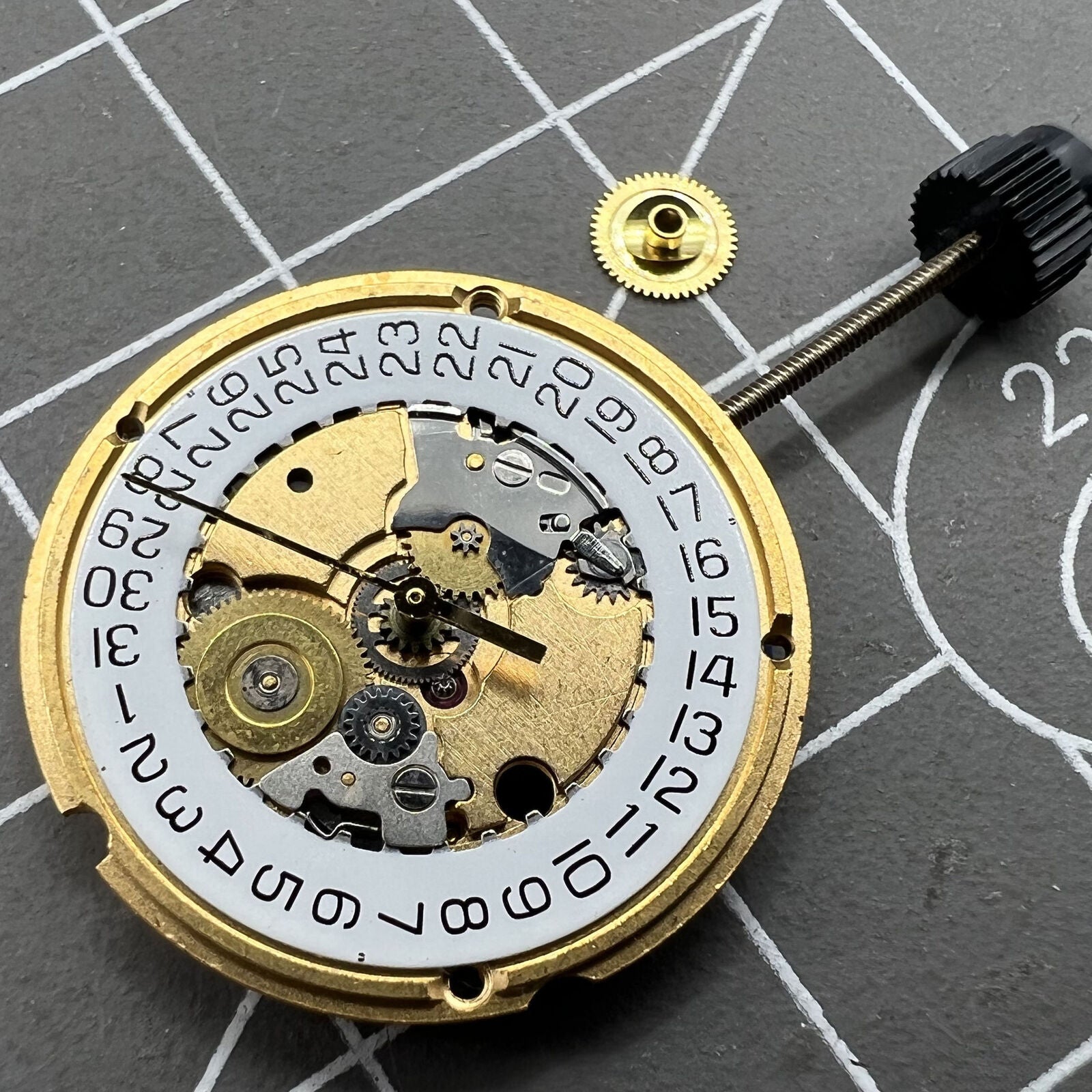 ETA 956.412 quartz watch movement with three hands and date at 3 o'clock for precise timekeeping.