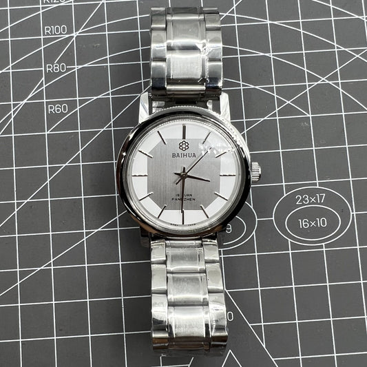 37mm China Baihua manual mechanical watch with silver dial, 19 jewels, shock-resistant design for durability.