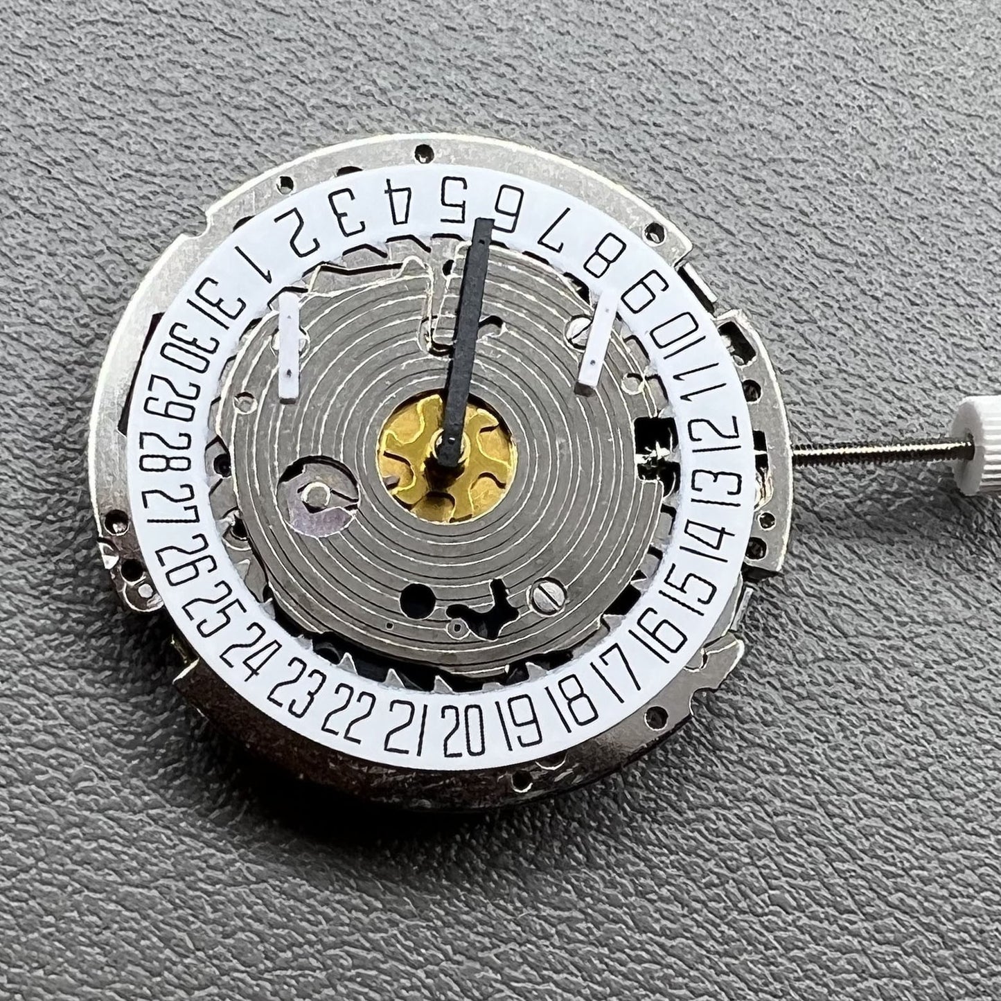 Swiss Made ISA 8171 silver quartz watch with 5 hands and date at 6 o'clock, elegant design.