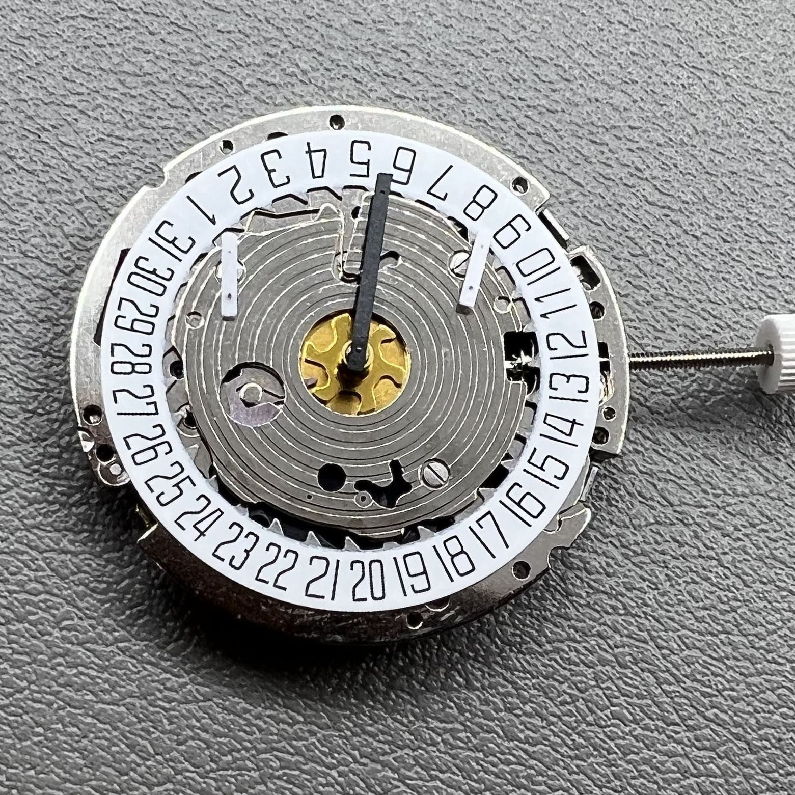 Swiss Made ISA 8171 silver quartz watch with 5 hands and date at 6 o'clock, elegant design.