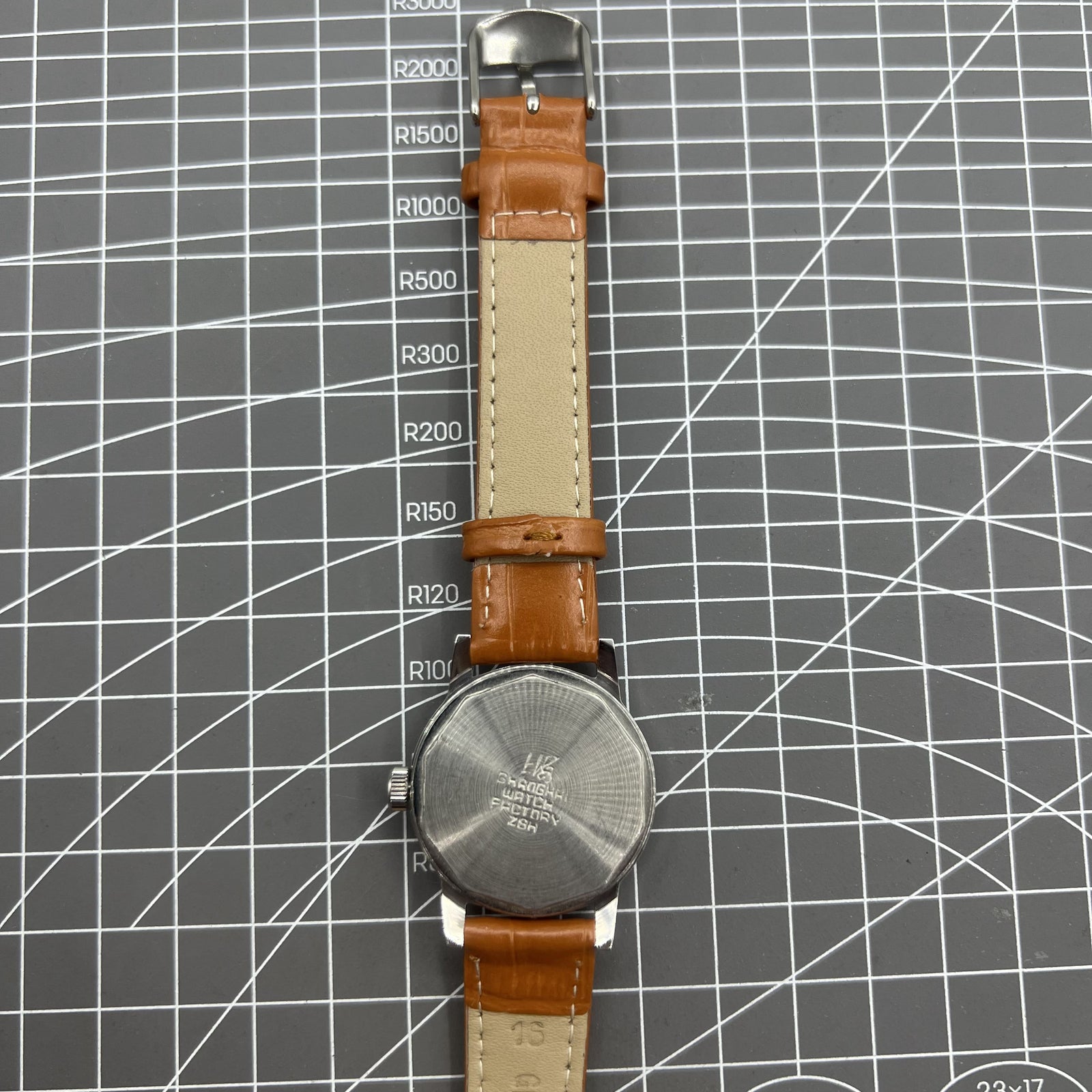 Silver 32mm Shanghai Factory manual mechanical watch with silver case, nail markers, and classic design