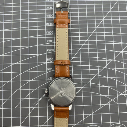 Silver 32mm Shanghai Factory manual mechanical watch with silver case, nail markers, and classic design