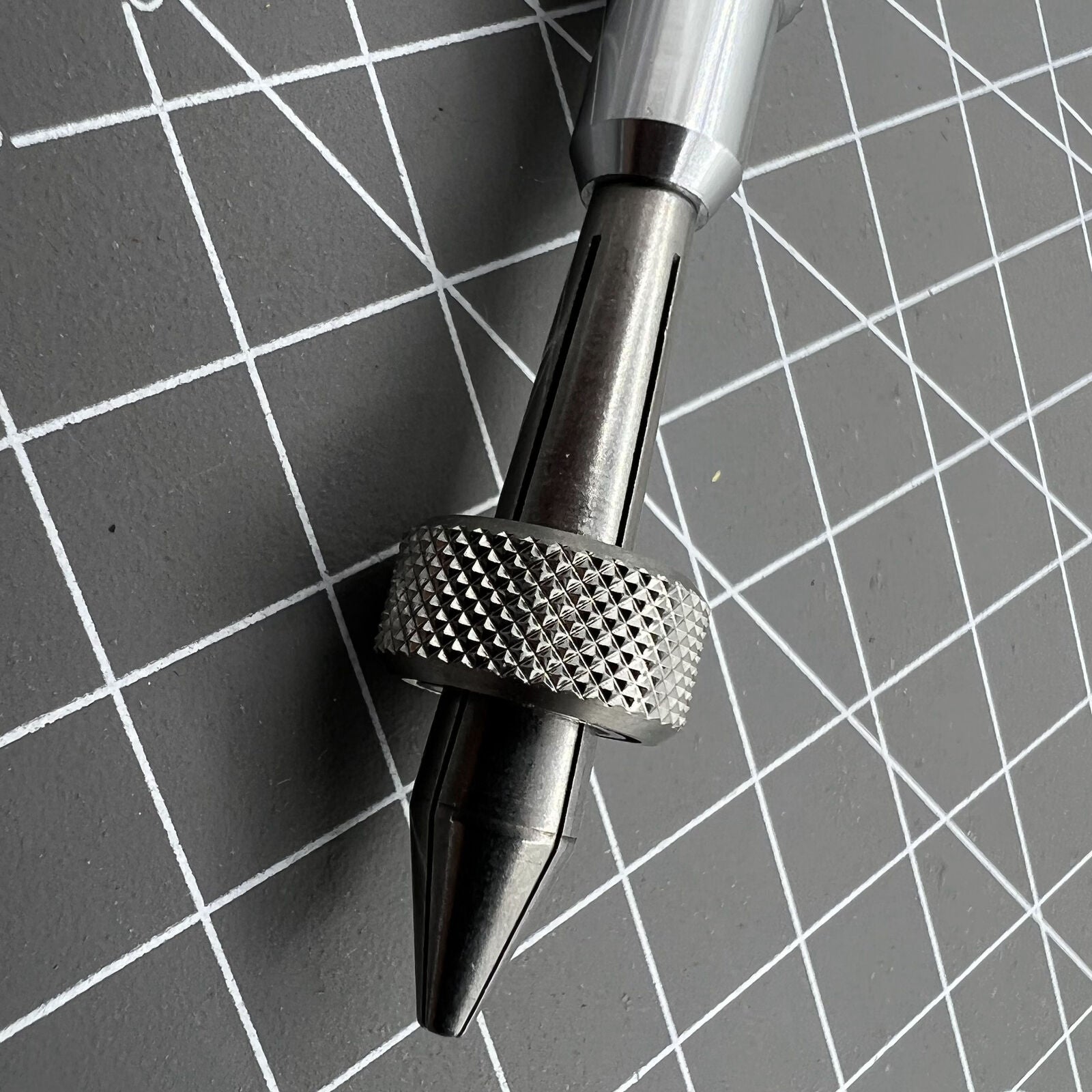 Holder clamp tool pin vice, precise watch accessory for securing crown lever during repair.