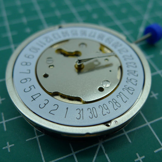 Ronda 5021D Swiss quartz watch movement with date display at 6, ideal for watch accessories.