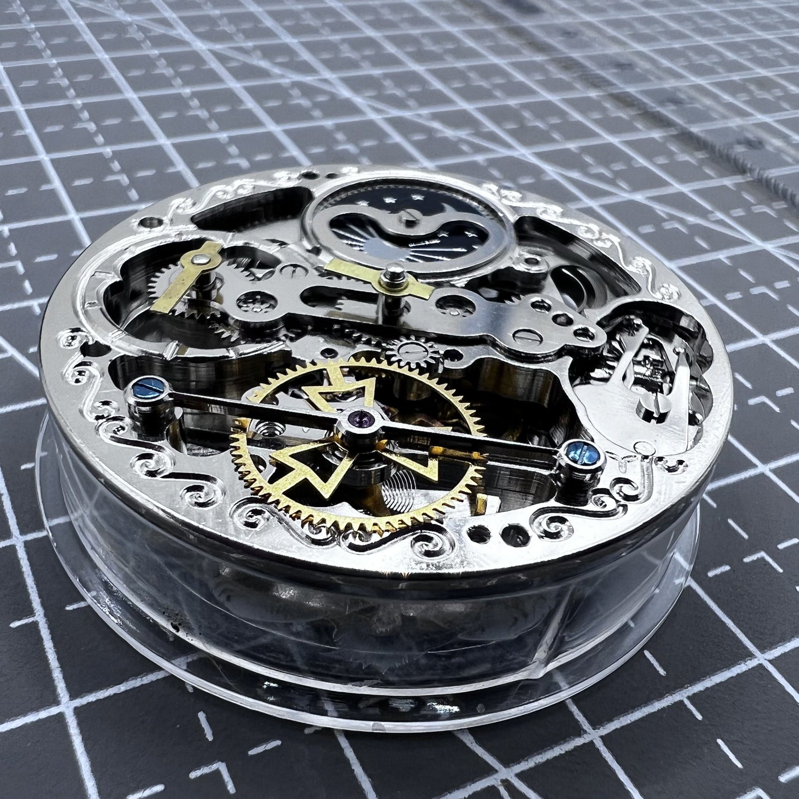 Small silver hollow watch movement with double mainspring and balance wheel at 6 o?clock by Kleines brand.