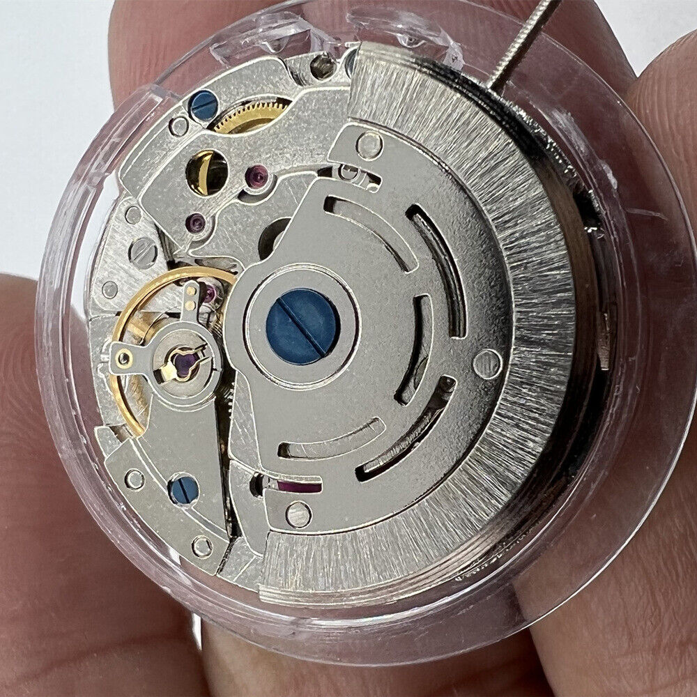 DG2813 mechanical watch movement showing 3 large hands and small seconds at 6 o'clock, no calendar display, Seiko brand.