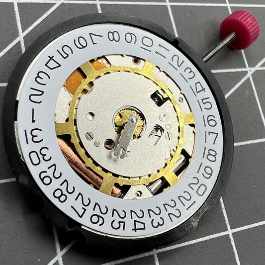 Swiss Ronda 714 quartz watch movement with date at 3, 2 hands, precision replacement part.