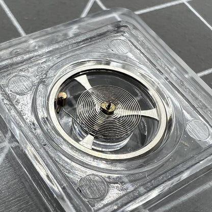 Balance wheel with hairspring for Movement 7009 Asian watch, ensuring precise timekeeping and smooth performance.