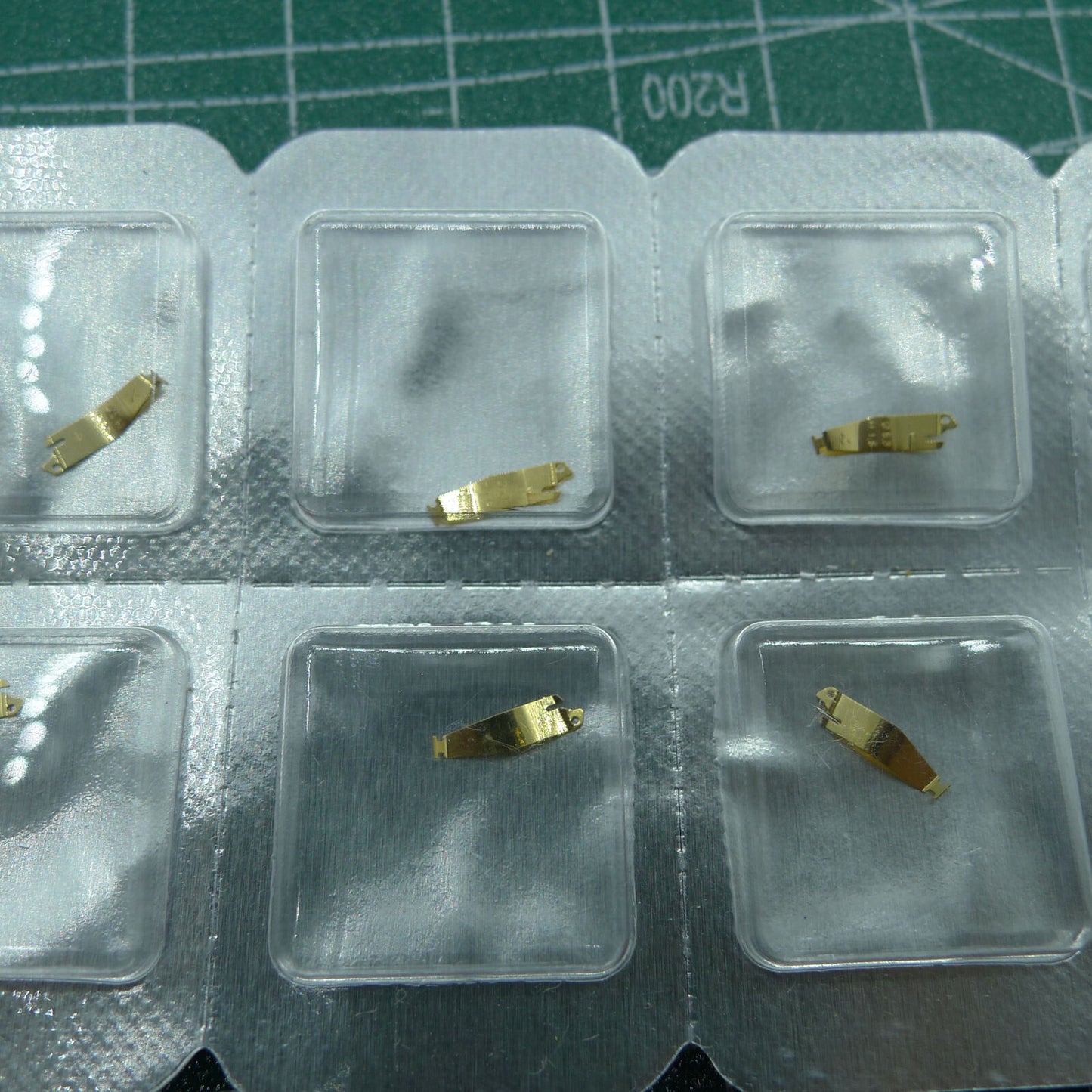 Wholesale battery fixing plate for ETA976.001 quartz watch movement, durable and precise replacement part.