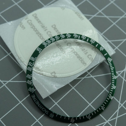 Green 38.5mm aluminum bezel with white font for Omega Speedmaster, precision watch upgrade accessory.