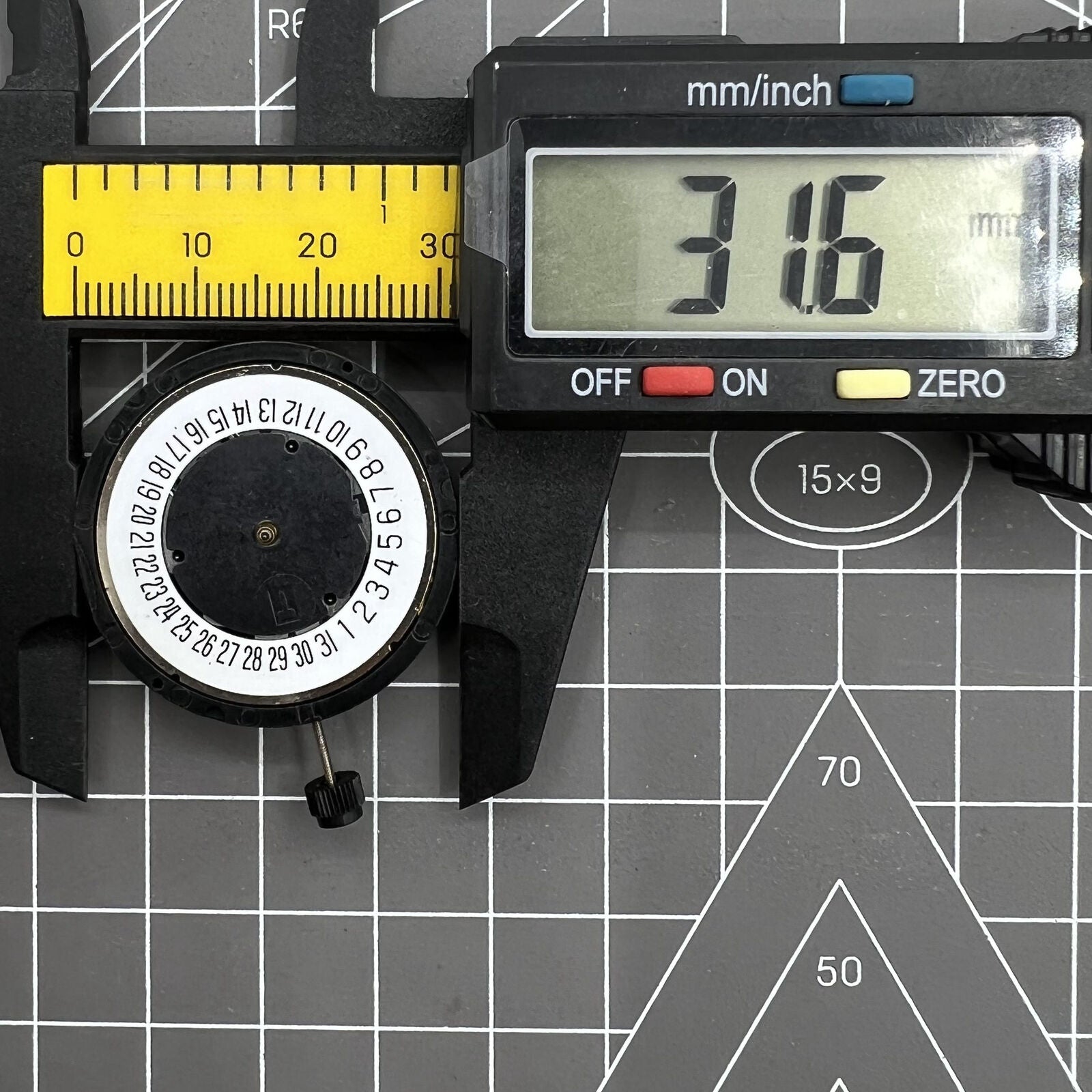 Genuine V8 ETA G10.711 Swiss quartz watch movement displaying date at 6 o'clock for precision timekeeping.