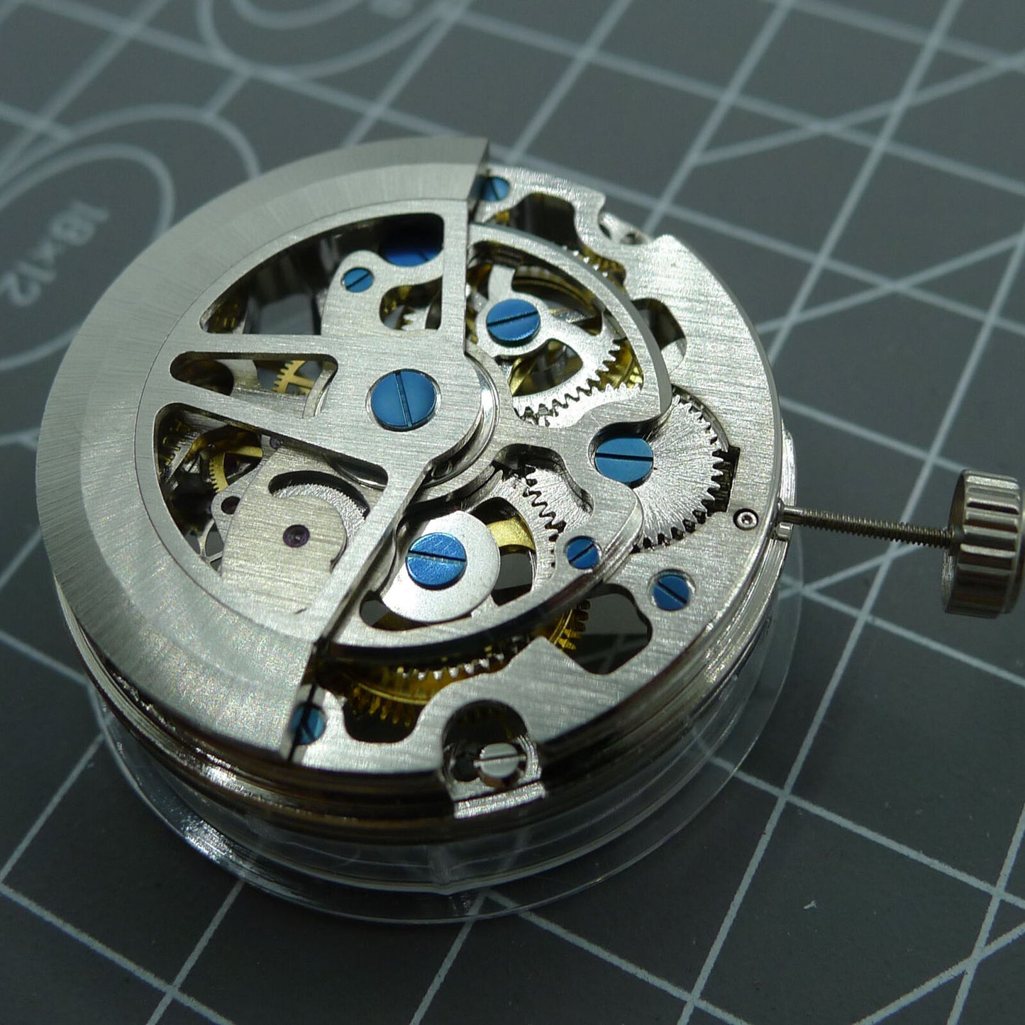 SL1911 silver hollow balance wheel watch movement displaying detailed automatic mechanical components.