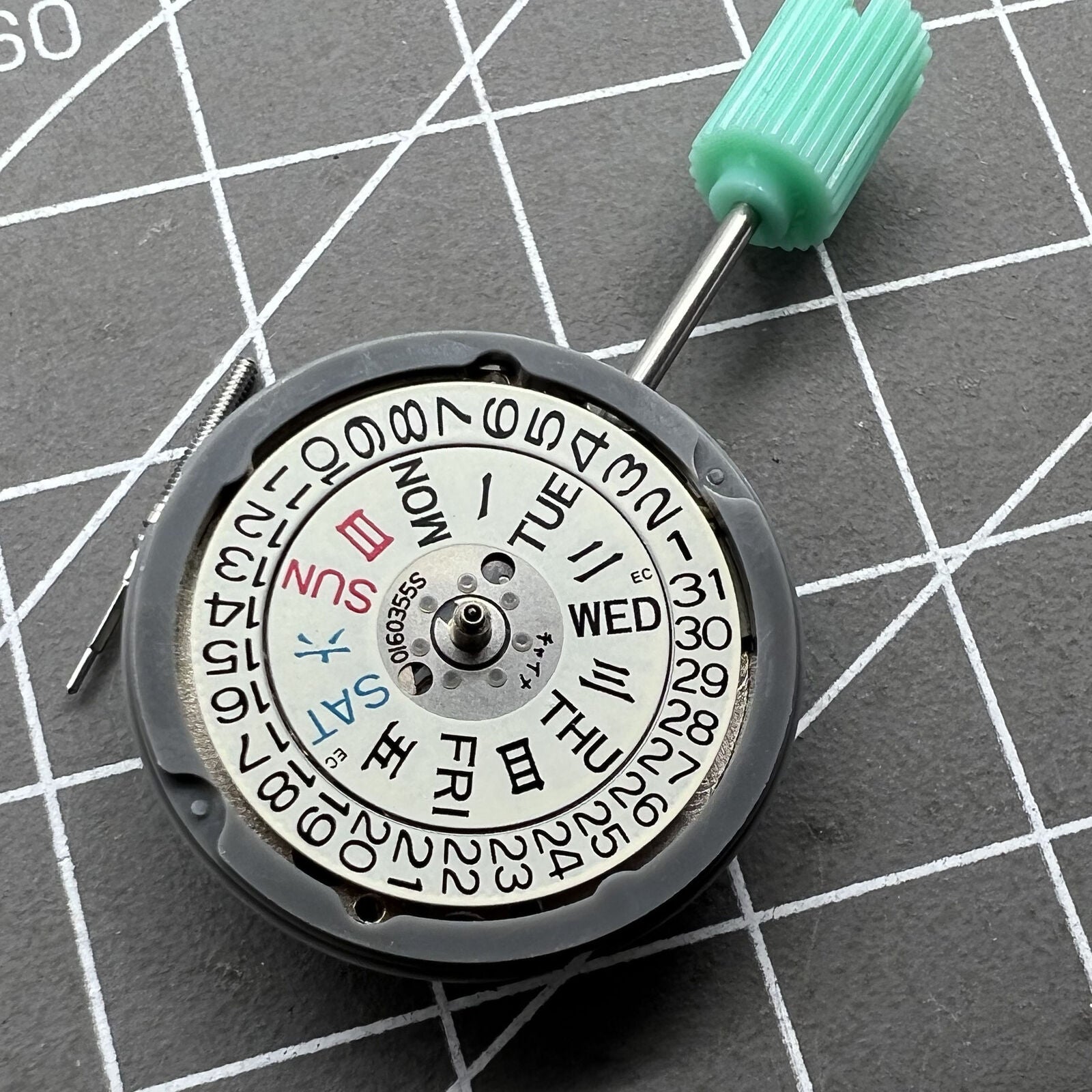 NH06A watch movement displaying double calendar date at 3 o'clock, precision Japanese mechanism by Seiko.
