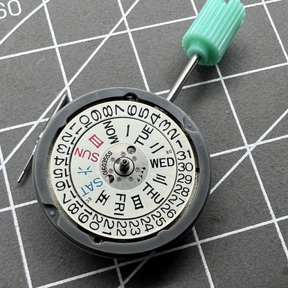 NH06A watch movement displaying double calendar date at 3 o'clock, precision Japanese mechanism by Seiko.