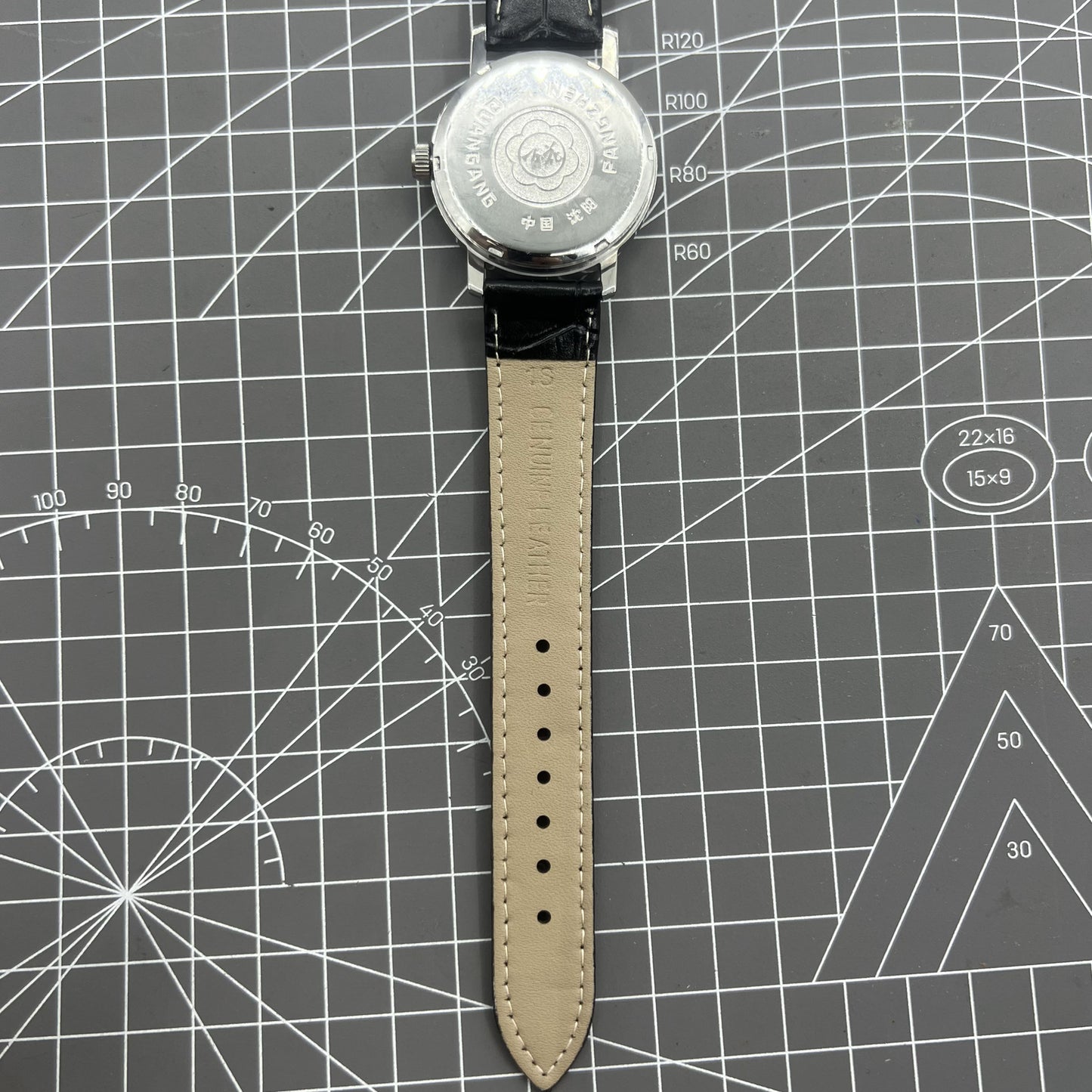 China Baihua 37mm manual mechanical watch with 19 jewels, silver dial, and shock-resistant design for durability.