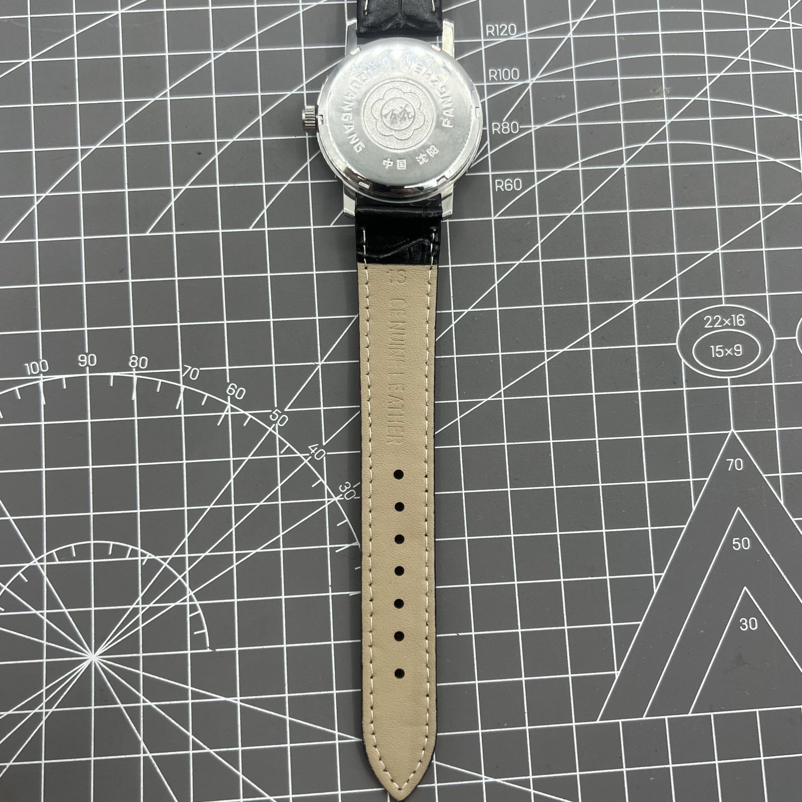China Baihua 37mm manual mechanical watch with 19 jewels, silver dial, and shock-resistant design for durability.