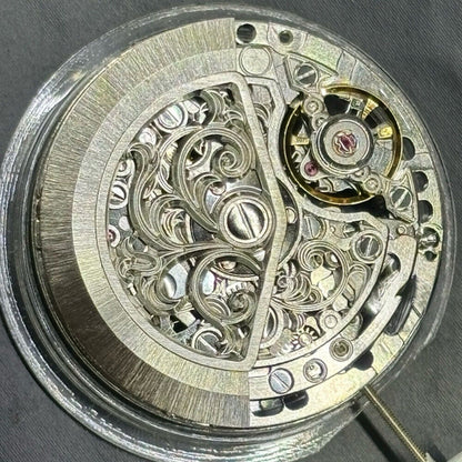 Silver hollow carved watch accessory featuring automatic 7750 mechanical movement for precision timekeeping.