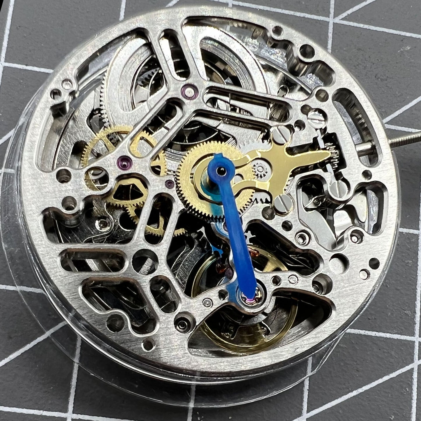 Asian HZ75DOA silver hollow balance wheel displaying automatic mechanical movement for watch accessories enthusiasts.