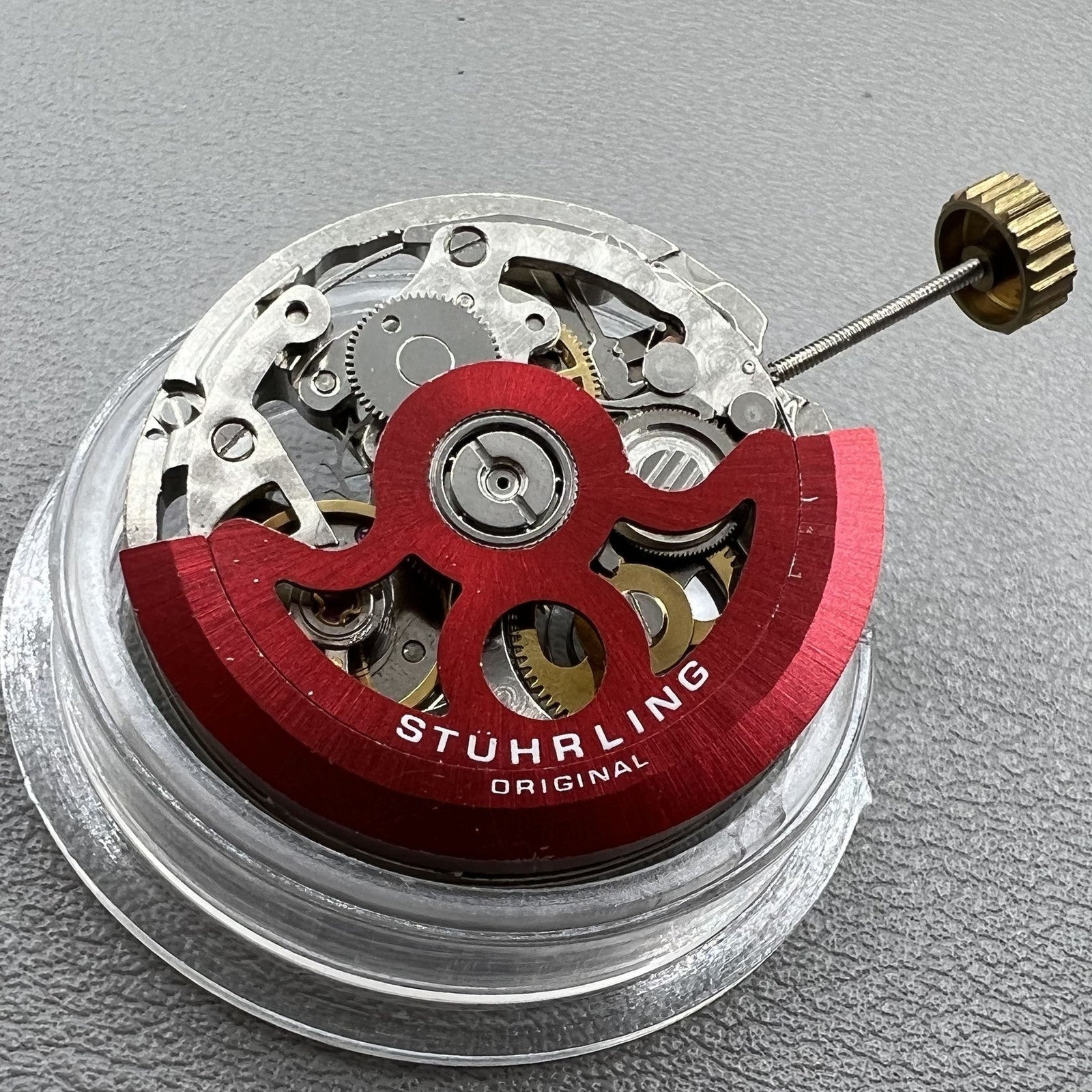 Hollow Hangzhou 2189 watch accessory showcasing automatic movement with red rotor and three hands for precision timekeeping.