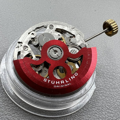 Hollow Hangzhou 2189 watch accessory showcasing automatic movement with red rotor and three hands for precision timekeeping.