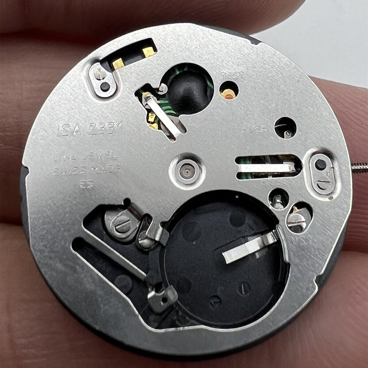 Watchmakers ISA 2331 quartz watch movement, precise replacement for 2321/103 models, durable repair part.