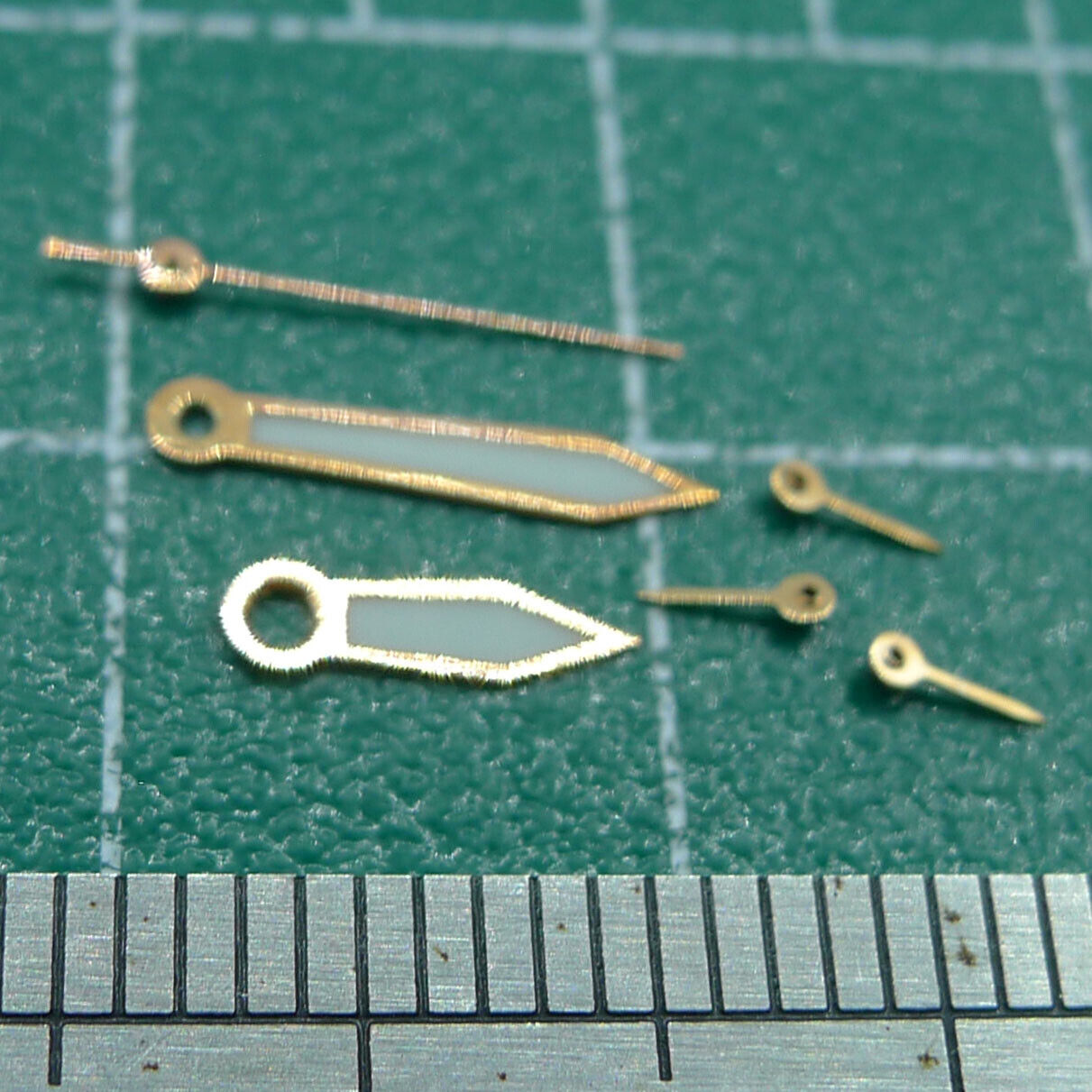 Set of 10mm luminous watch hands for Miyota OS series, ensuring clear time reading in low light.