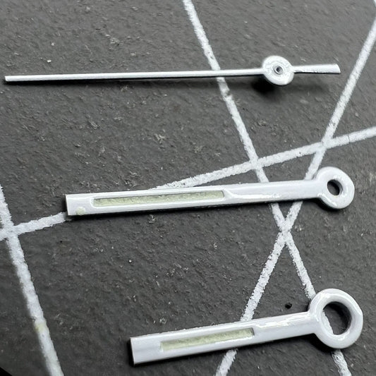 Silver-trimmed green luminous square tip watch hands for Miyota 6M12, enhancing dial readability.