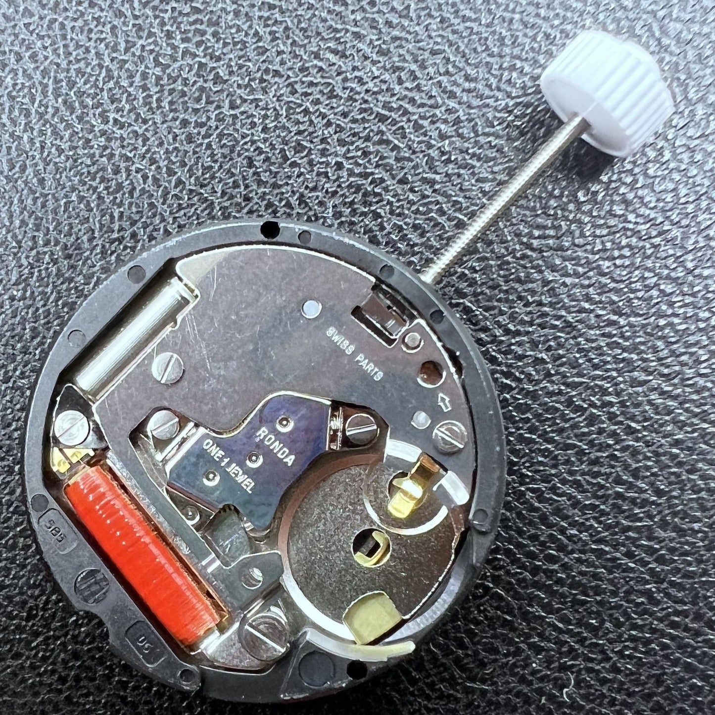 Ronda 585 Swiss quartz watch movement with date at 6 o'clock, precision timekeeping.