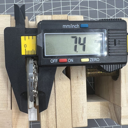 Seiko NH36A watch movement with white dial and blue lume, featuring 3/3.8 crown positions for accuracy.