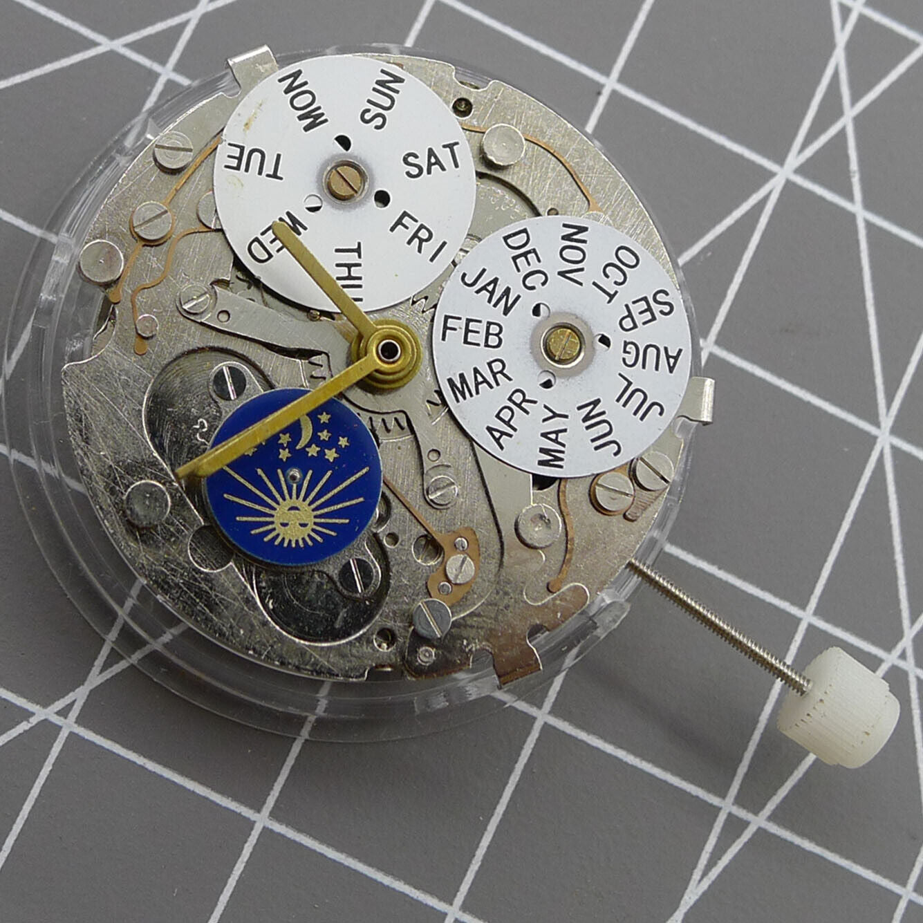 Automatic mechanical watch with silver case, week and month display at 12, moon phase at 6.