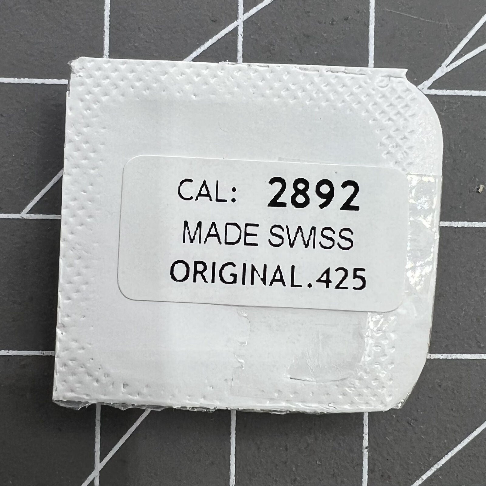 Omega Cal.1120 Swiss watch movement part, precision repair component for watch restoration.