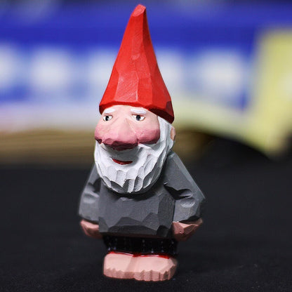 Handmade wooden dwarf garden elf figurine, charming decorative sculpture for outdoor display.