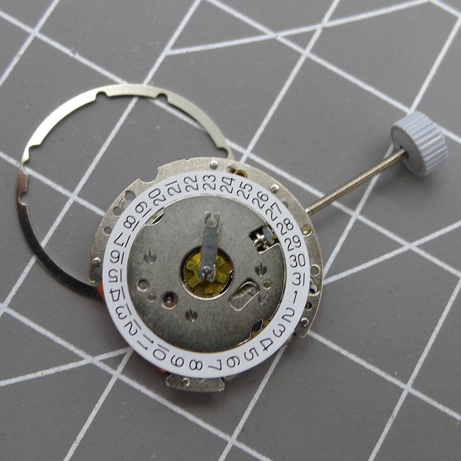 Swiss Made Ronda 774 quartz watch movement with date display at 3 o'clock, Swiss precision.