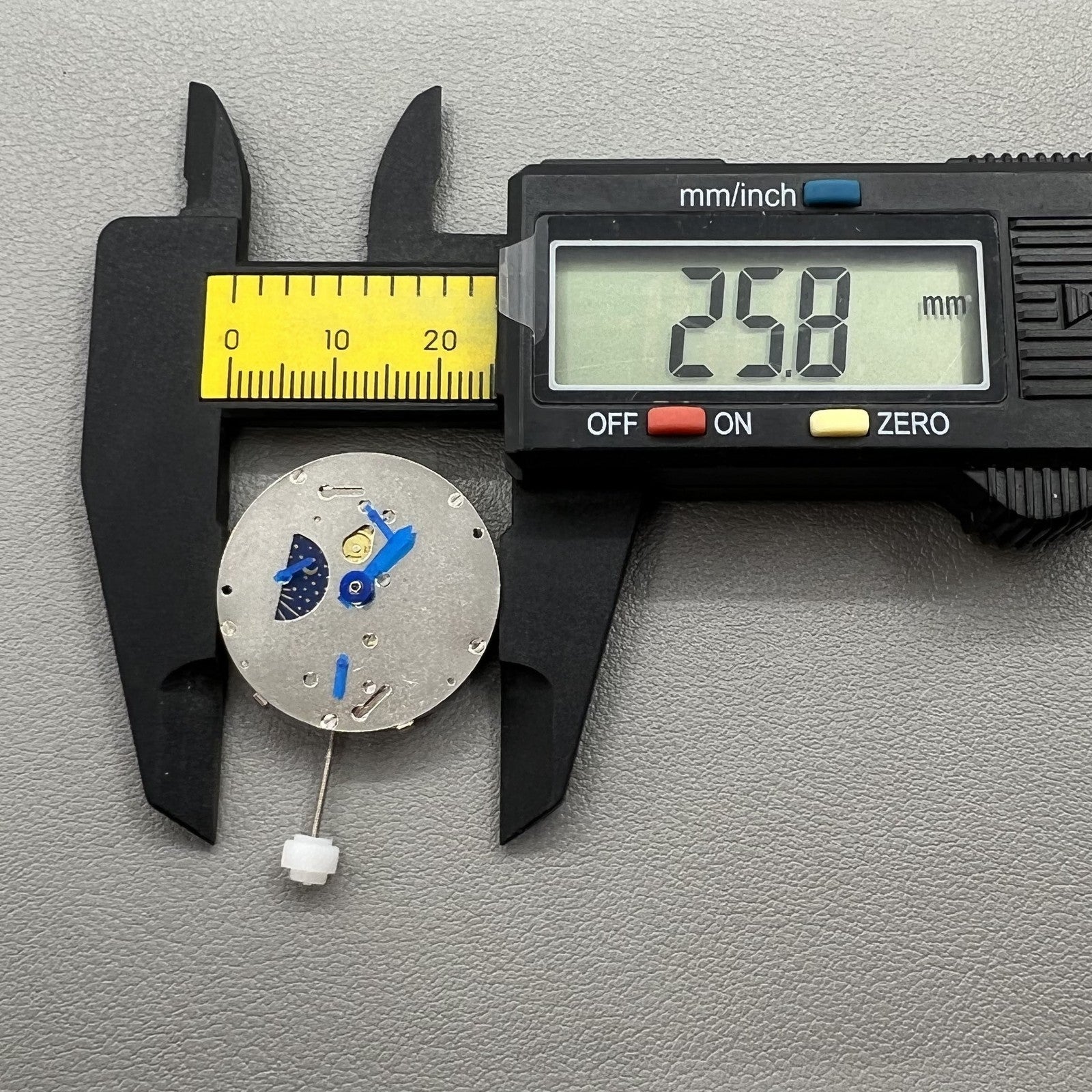 China Made 8205 automatic mechanical watch movement showing small seconds at 3, 6, and 9 o'clock positions for precise timekeeping.