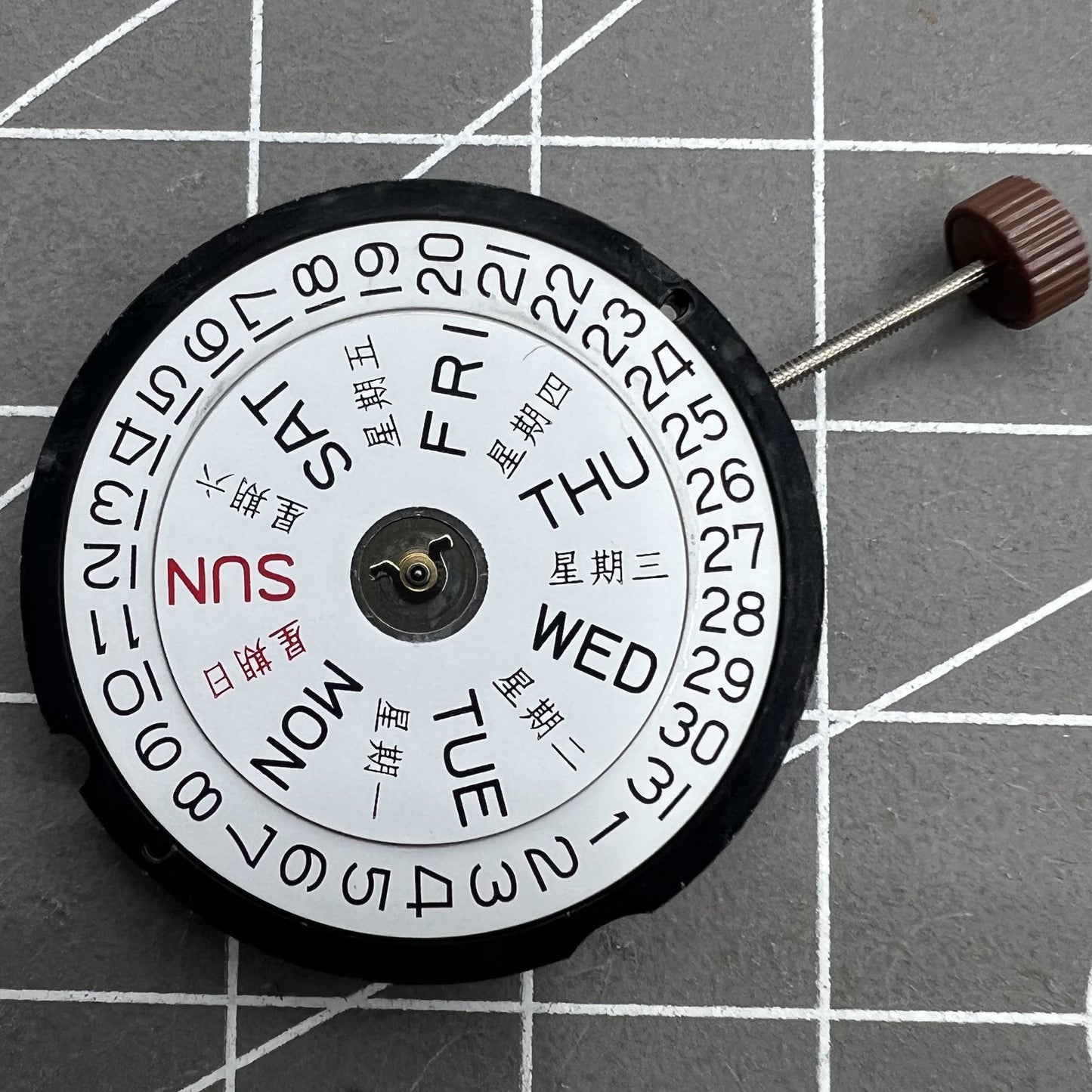 Ronda 517 quartz watch movement with day and date display at 3 o'clock position, suitable for watch accessories.
