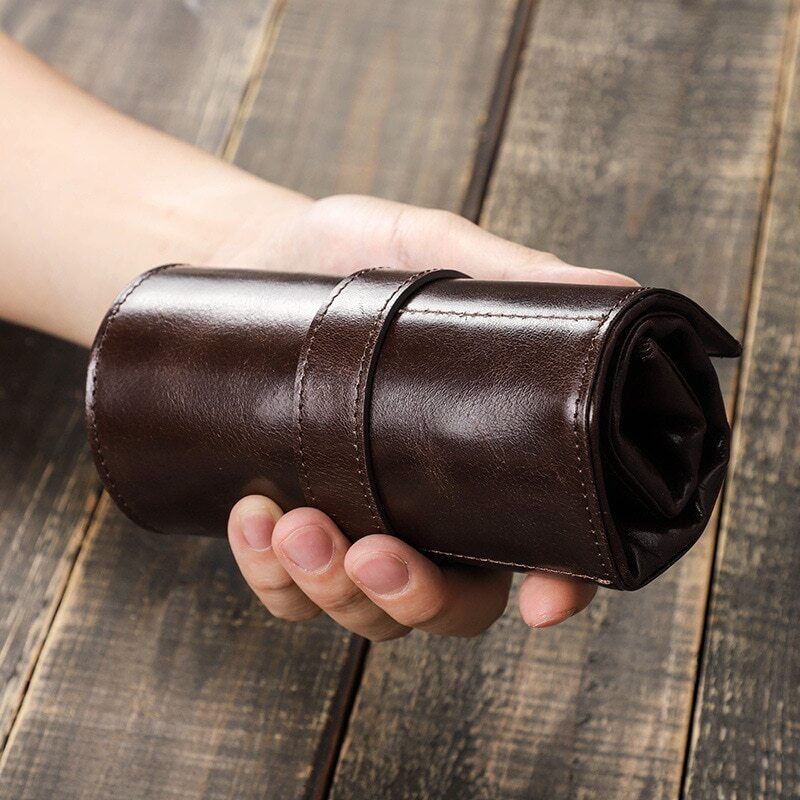 Handmade leather watch box with 6 slots, portable roll pouch for men, durable and stylish accessory storage.