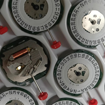Japan Miyota 2317 quartz watch movement with date display at 3, silver repair part for precision timepieces.