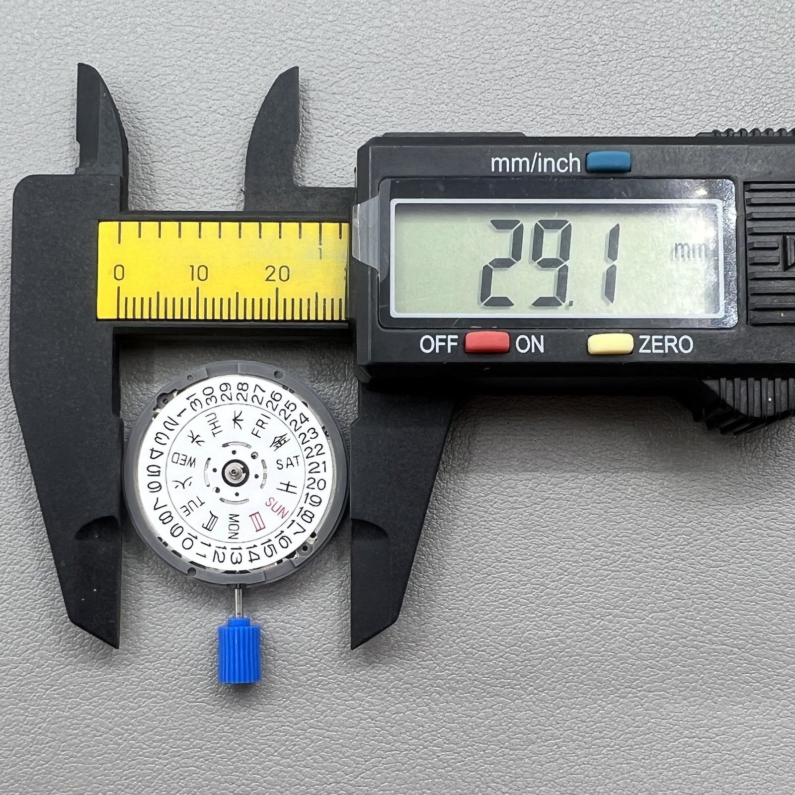 Seiki NH36 watch movement with white dial, featuring Japanese-English day display for precision timekeeping.