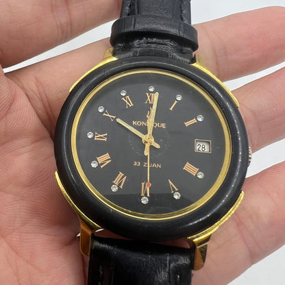 37mm automatic mechanical watch with black dial and golden Roman numerals, featuring 33 jewels.