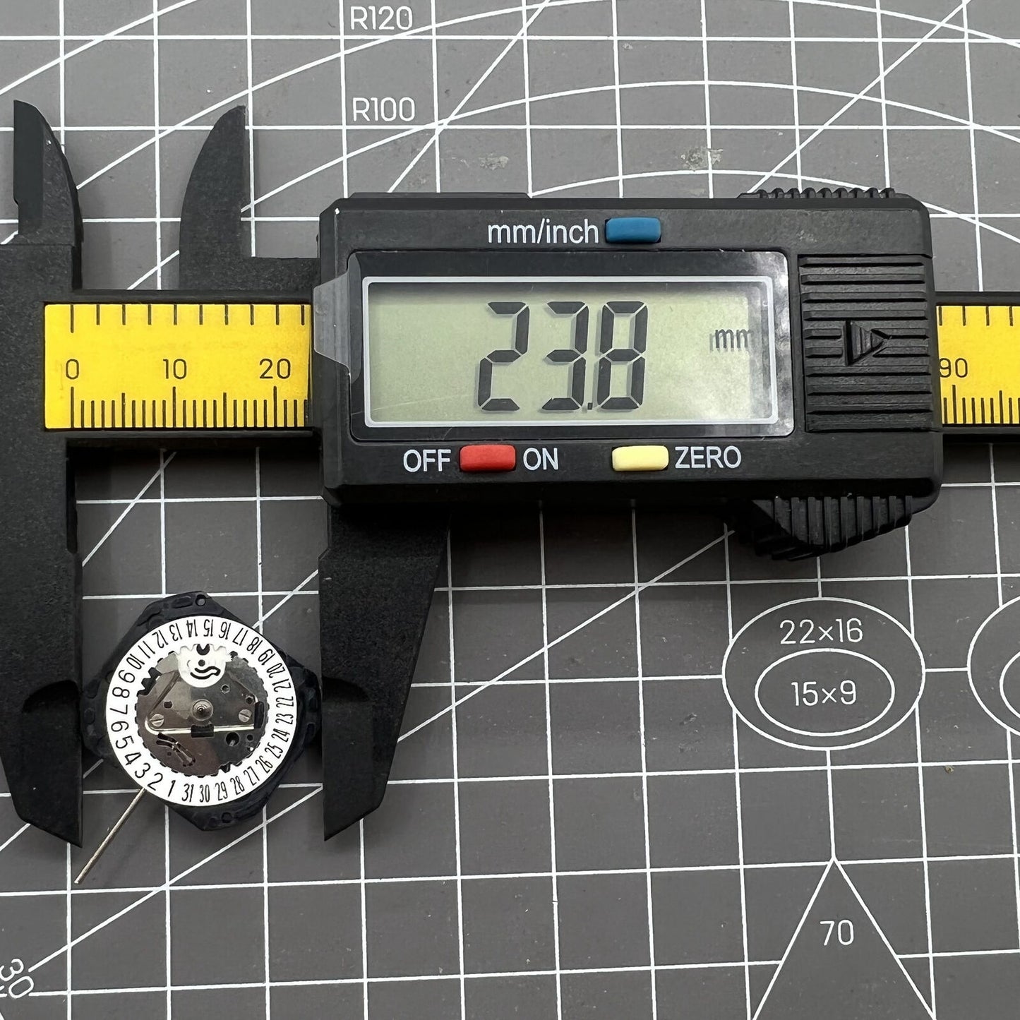 Seiko VX22 quartz watch movement with white date disks at 3 and 6 o'clock, Japan made.